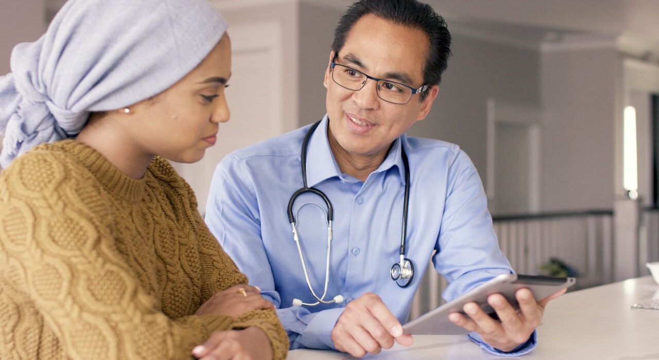 Oncologist with cancer patient